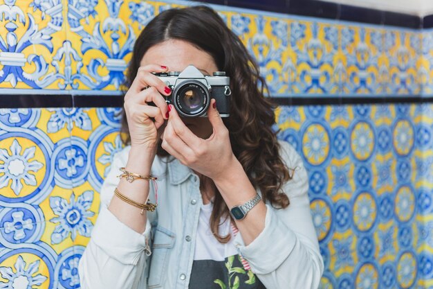 Close-up of woman taking a photograph