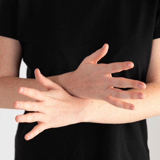 Close-up woman teaching sign language