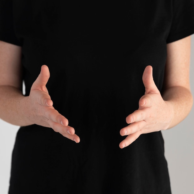 Close-up woman teaching sign language