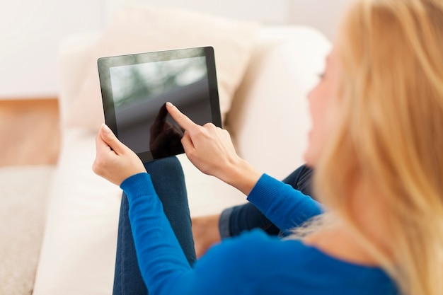 Close up of woman using digital tablet