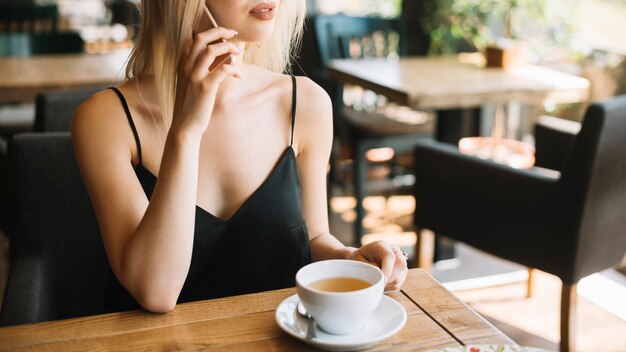 Close-up of woman using mobile phone talking on cell phone