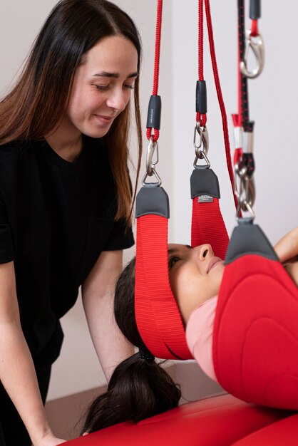 Close up woman using therapeutic equipment