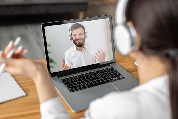 Close up woman videocalling employee