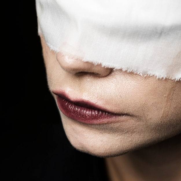 Close-up of woman wearing blindfold