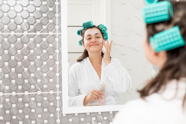 Close-up woman wearing curlers