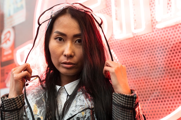 Free photo close-up woman wearing raincoat