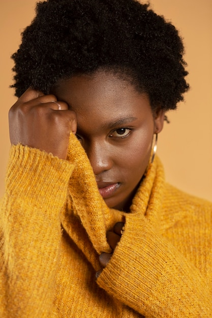 Close up woman wearing yellow sweater