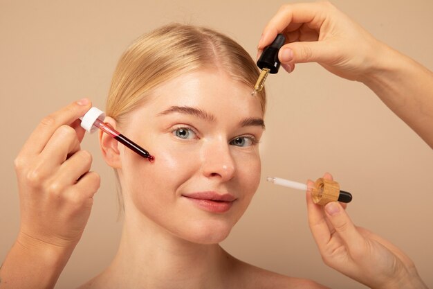 Close up woman with beauty products