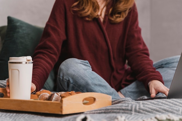 Free photo close-up woman with breakfast in bed