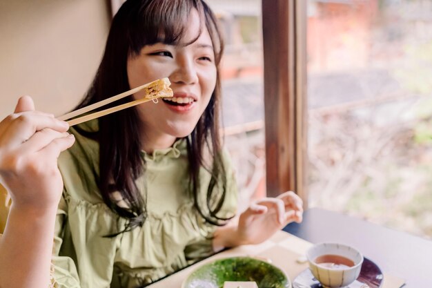 Close up woman with chopsticks