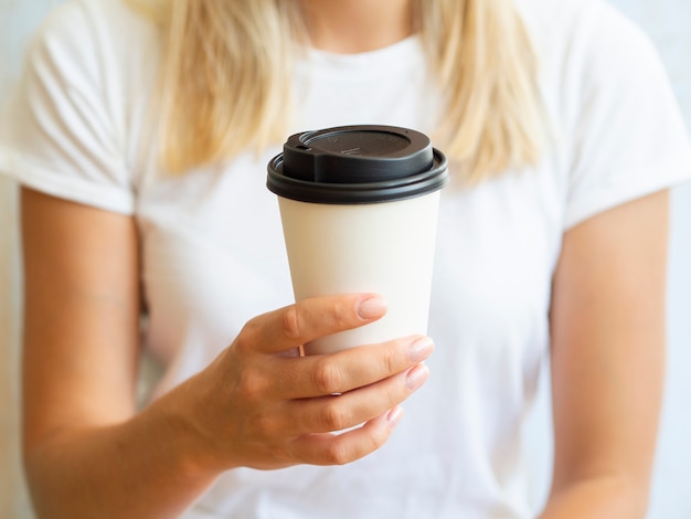 Close-up woman with coffee cup