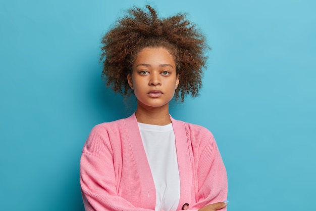 Close up on woman with combed natural Afro hair isolated