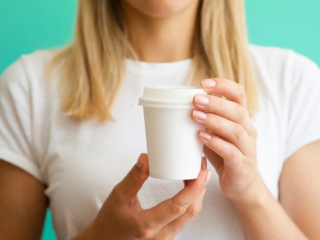 Close-up woman with cup of coffee