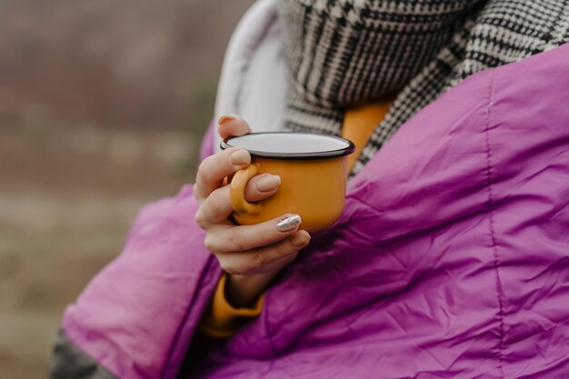 Close-up woman with cup of tea