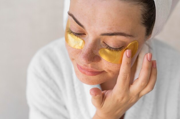 Close-up woman with eye patches