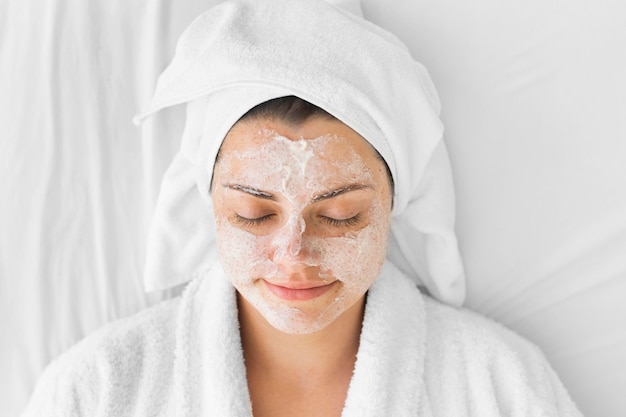 Close-up woman with face cream