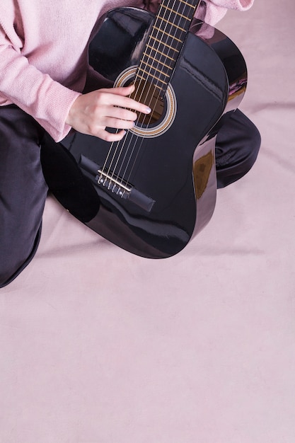 Close up of woman with guitar