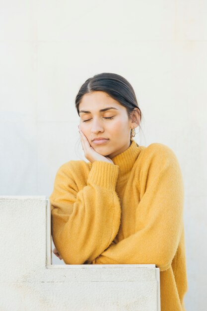 close-up of a woman with her eyes closed