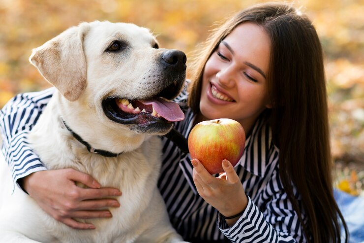 Close-up woman with her puppy in the park
