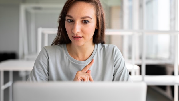 Free photo close up woman with laptop