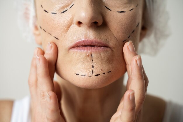 Close up woman with marker traces on face