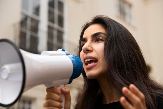 Close up woman with megaphone