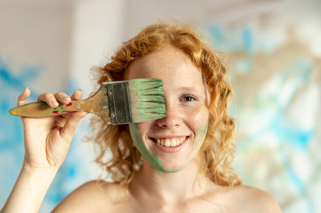 Close-up woman with painted face