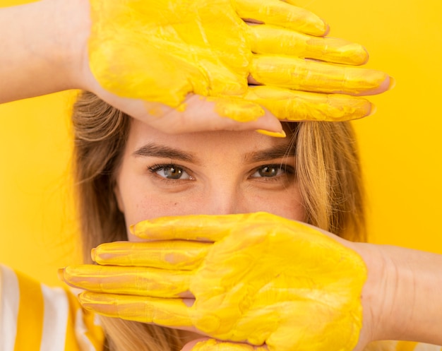 Close-up woman with painted hands