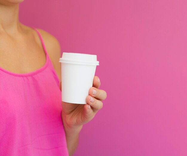 Close-up woman with pink shirt and copy-space