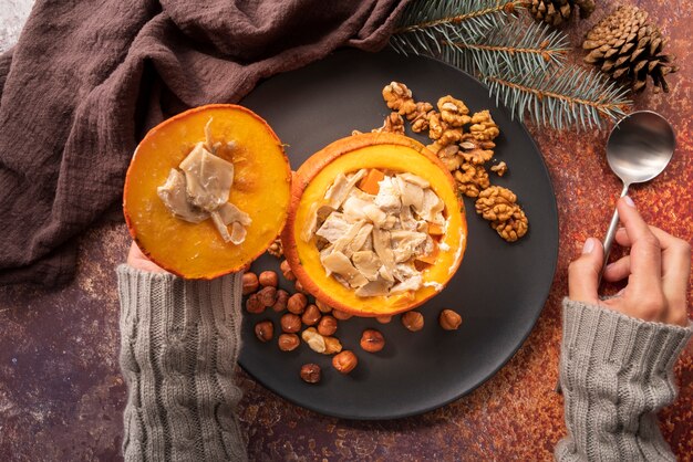 Close-up woman with pumpkin and spoon