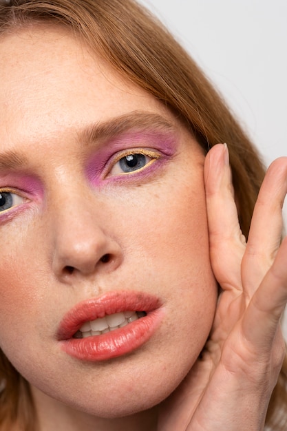 Close up woman with purple eyeshadow