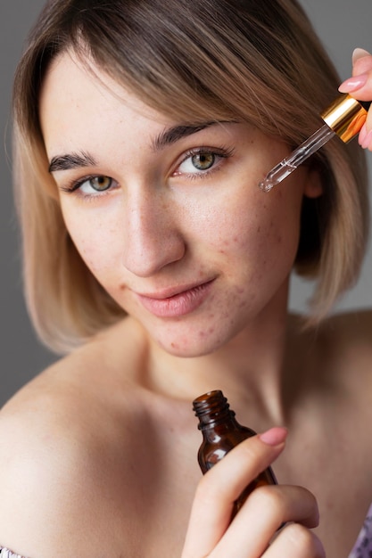 Close up woman with serum