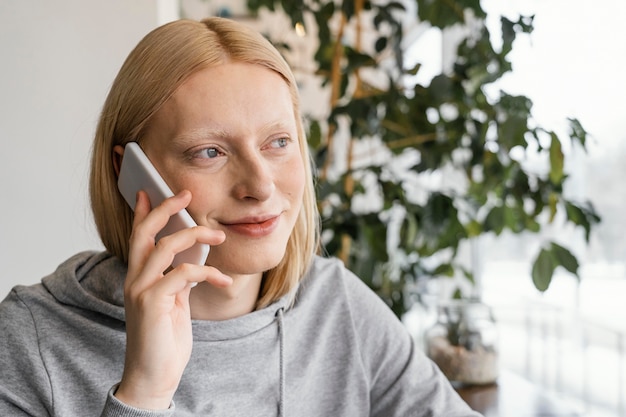 Close-up woman with smartphone