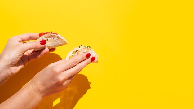 Close-up woman with taco and copy-space