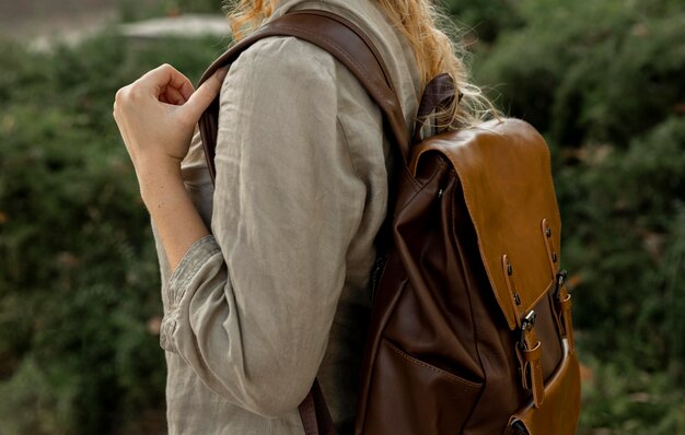 Close-up woman with vintage backpack