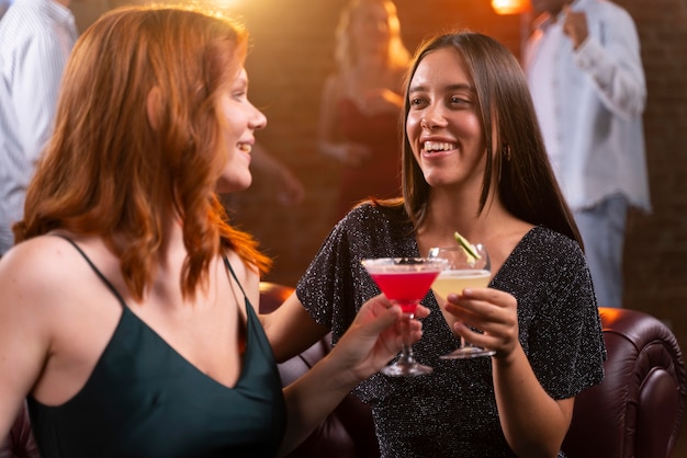 Close up women at bar with drinks