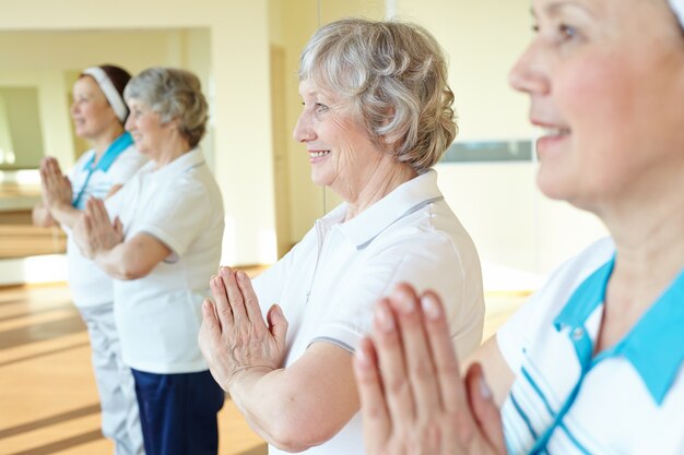 Close-up of women doing relaxation exercises