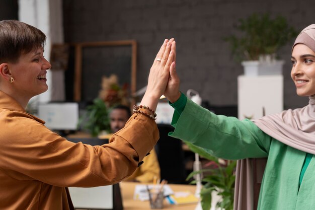 Close up women high five