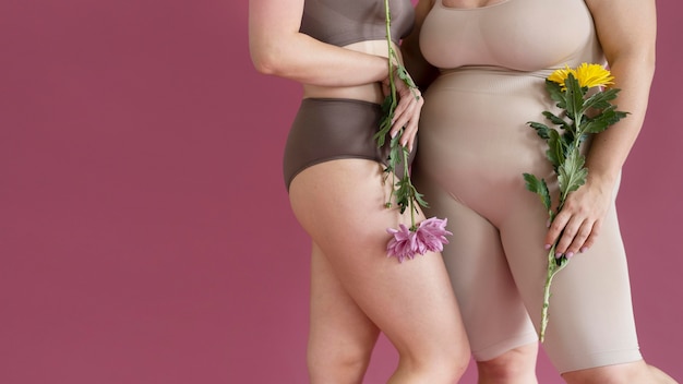 close up women holding flowers
