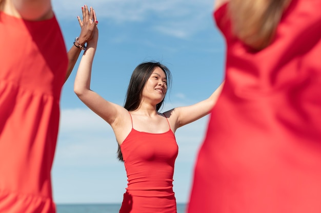 Close up women holding hands