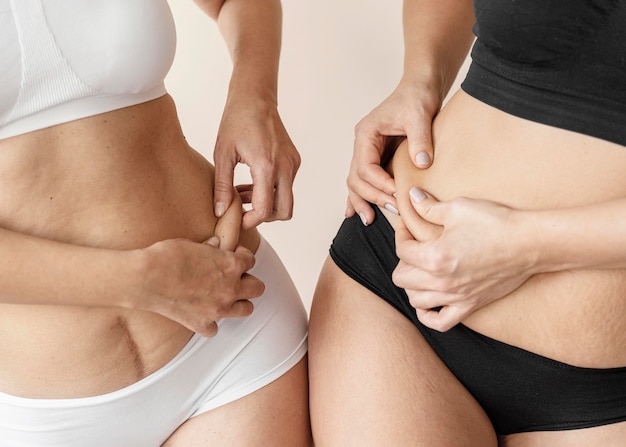 Close up women holding skin