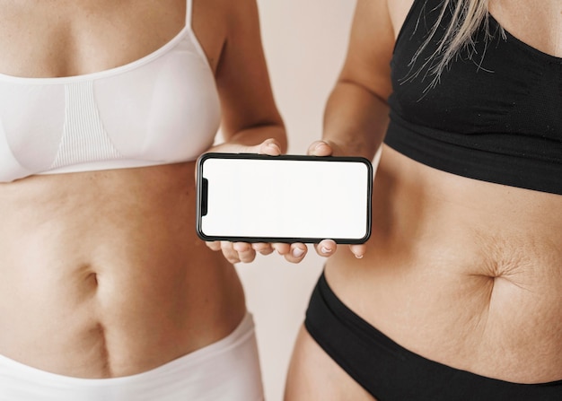 Close up women holding smartphone