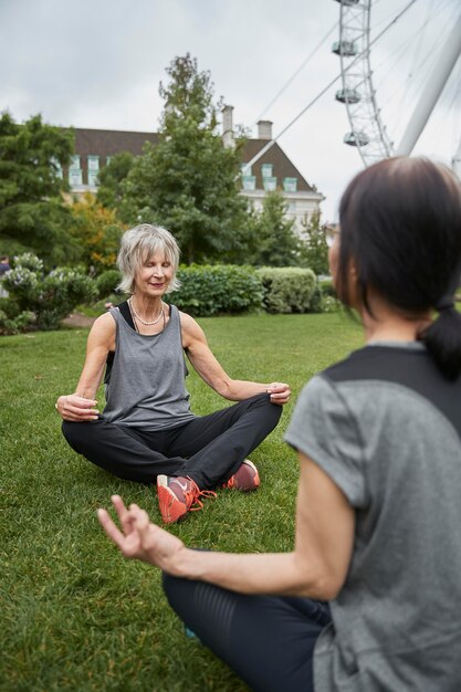 Close up women meditating outdoors