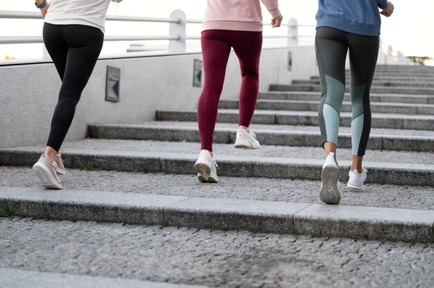 Close up women running on stairs