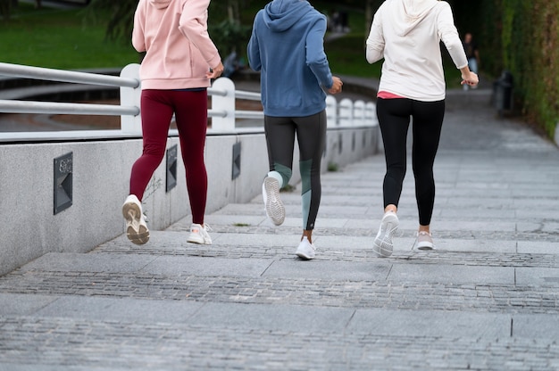 Free photo close up women running together