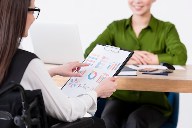 Close-up women with charts