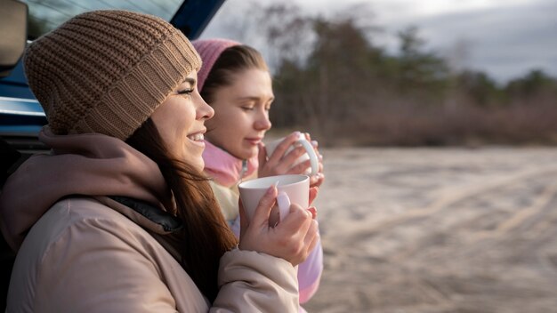 Close up women with hot drinks