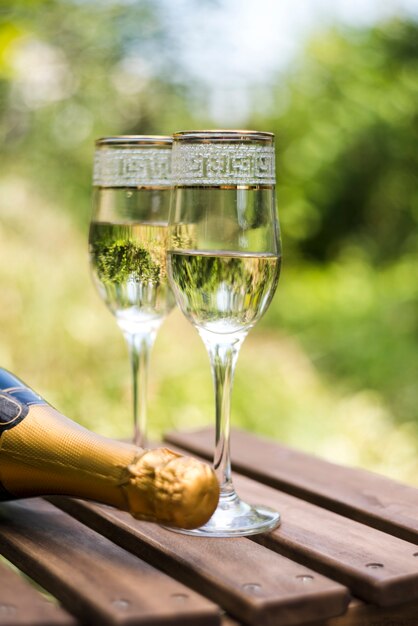 Close-up of wooden crate of champagne glasses at outdoors