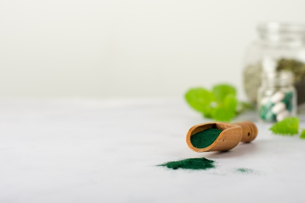 Free photo close-up wooden spoon with medicine