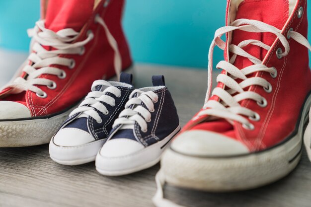 Close-up of wooden surface with decorative shoes